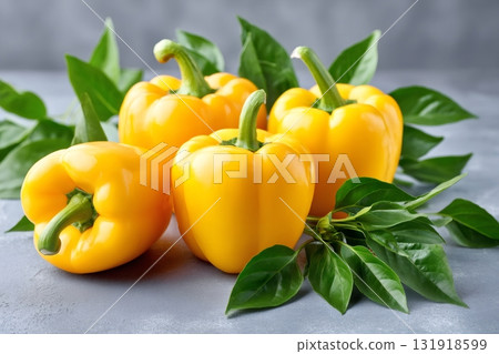 Fresh yellow bell pepper vegetables with green leaves 131918599