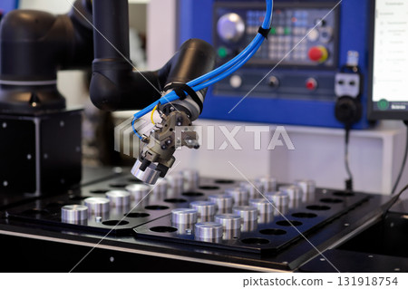 robot manipulator loads workpiece in CNC machine robot manipulator loads workpiece in CNC machine 131918754