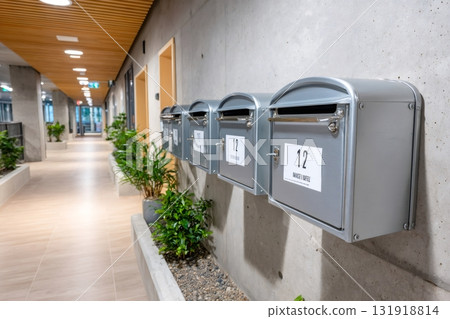 Row of mailboxes on concrete wall inside modern apartment building Row of mailboxes on concrete wall inside modern apartment building 131918814
