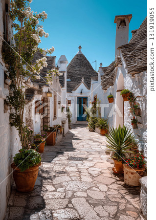 Charming narrow street lined with trulli houses in Alberobello Italy 131919055