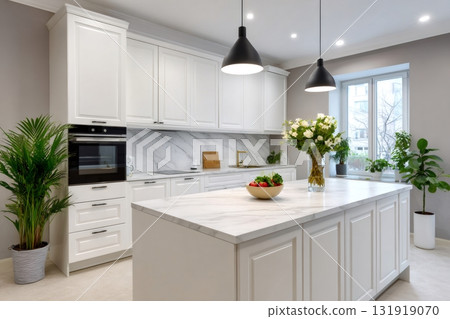Modern kitchen interior with white marble island 131919070