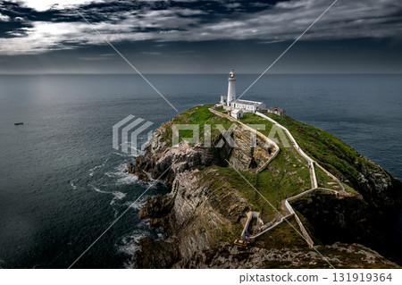 South Stack Island At The Atlantic Coast With South Stack Lighthouse And View To The Irish Sea In North Wales, United Kingdom South Stack Island At The Atlantic Coast With South Stack Lighthouse And View To The Irish Sea In North Wales, United Kingdom 131919364