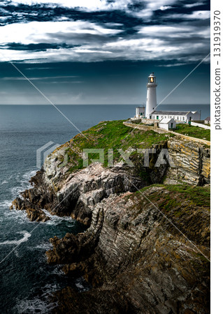 South Stack Island At The Atlantic Coast With South Stack Lighthouse And View To The Irish Sea In North Wales, United Kingdom South Stack Island At The Atlantic Coast With South Stack Lighthouse And View To The Irish Sea In North Wales, United Kingdom 131919370