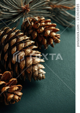 Close-up of spruce and pine cones on a green background. Christmas background. 131919385