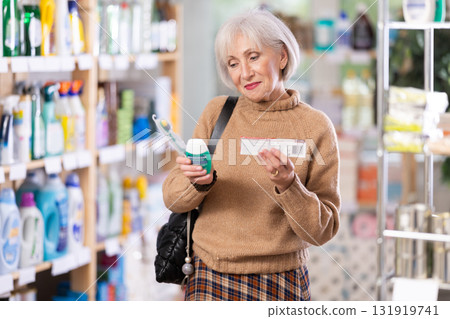 Elderly woman choosing dental care kit Elderly woman choosing dental care kit 131919741