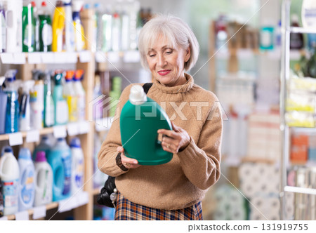 Woman choosing a large fabric softener 131919755