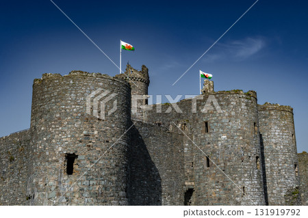 Harlech Castle With Waving Flags In Gwynedd, North Wales, United Kingdom Harlech Castle With Waving Flags In Gwynedd, North Wales, United Kingdom 131919792