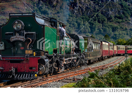 Old Train With Steam Locomotive At Beddgelert Train Station In Snowdonia National Park In Wales, United Kingdom Old Train With Steam Locomotive At Beddgelert Train Station In Snowdonia National Park In Wales, United Kingdom 131919796