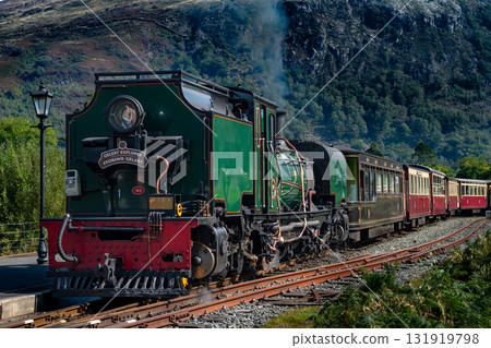 Old Train With Steam Locomotive At Beddgelert Train Station In Snowdonia National Park In Wales, United Kingdom Old Train With Steam Locomotive At Beddgelert Train Station In Snowdonia National Park In Wales, United Kingdom 131919798
