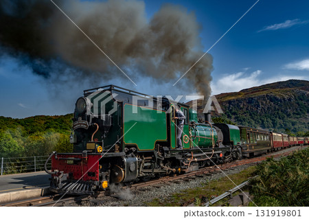 Old Train With Steam Locomotive At Beddgelert Train Station In Snowdonia National Park In Wales, United Kingdom Old Train With Steam Locomotive At Beddgelert Train Station In Snowdonia National Park In Wales, United Kingdom 131919801