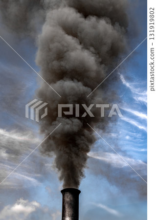 Industrial Chimney Emitts Black Smoke With Pollutants Into The Atmosphere Supporting Global Warming Industrial Chimney Emitts Black Smoke With Pollutants Into The Atmosphere Supporting Global Warming 131919802