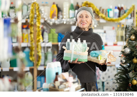 Mature woman shopping for Christmas presents at home goods store Mature woman shopping for Christmas presents at home goods store 131919846