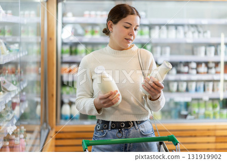 woman chooses dairy products woman chooses dairy products 131919902