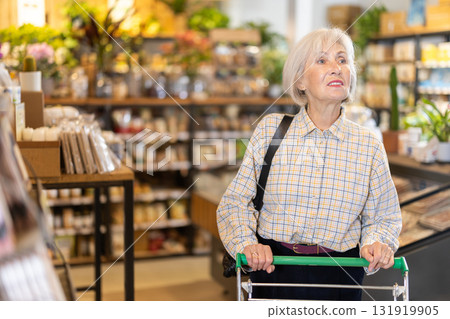 woman walks around an eco supermarket 131919905