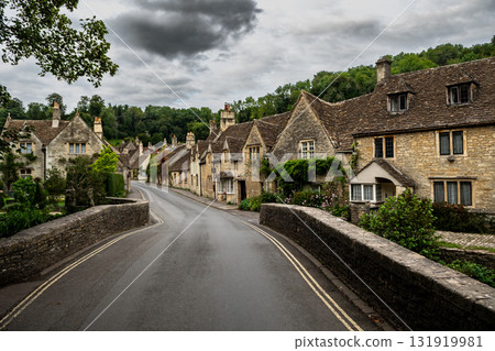 Picturesque Village Castle Combe In The Cotswolds Area In Wiltshire In England, United Kingdom Picturesque Village Castle Combe In The Cotswolds Area In Wiltshire In England, United Kingdom 131919981