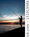 Silhouette Of A Fisherman With His Pole At The Atlantic Coast Of Wales, United Kingdom 131919988