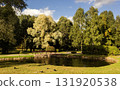 an urban park with an artificial lake in early autumn 131920538