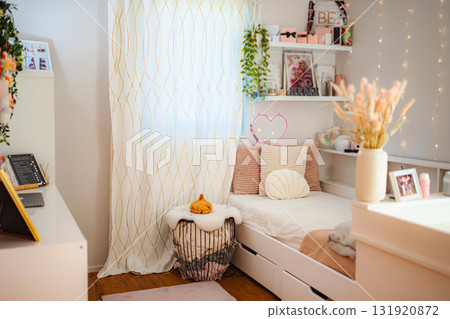 Cozy feminine bedroom interior decor with pink accents Cozy feminine bedroom interior decor with pink accents 131920872