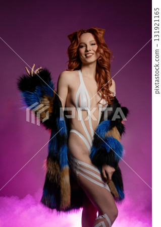 Exploring body art with fur and tape in a vibrant studio setting 131921165