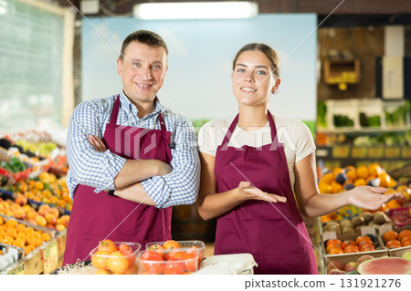 Supermarket workers waiting for visitors and ready willing to help with selection of fresh products 131921276