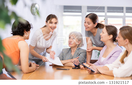 Female students learning course subject together in university classroom Female students learning course subject together in university classroom 131921517