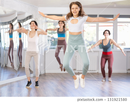 Group of women dancing modern dance in studio 131921580