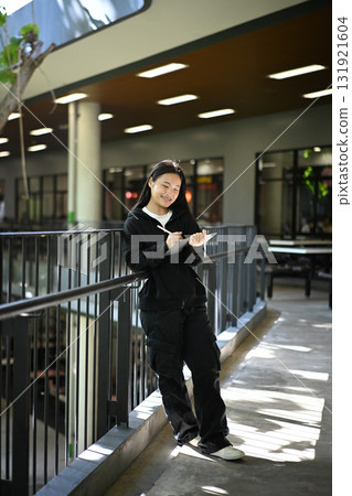 A teenage girl enjoying her creativity through digital art on a tablet 131921604