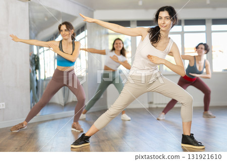 Group of women dancing hip hop in studio Group of women dancing hip hop in studio 131921610