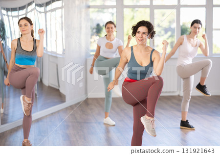 Slender young women dancers dance twist in modern way 131921643