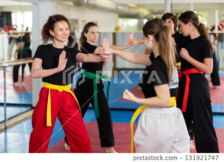 Women in sportswear in self-defense training 131921747