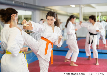 Women in kimonos do karate 131921797