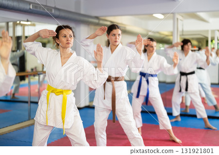 Female athletes standing in formation, kata starting position 131921801
