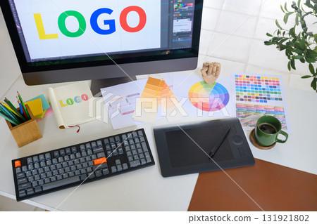 Top view of graphic design workstation with branding project in progress 131921802