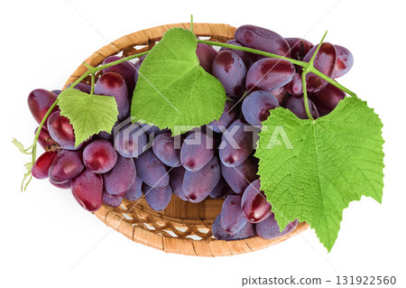 Red grape berry bunch in a wicker basket isolated on white background. Top view. Flat lay Red grape berry bunch in a wicker basket isolated on white background. Top view. Flat lay 131922560
