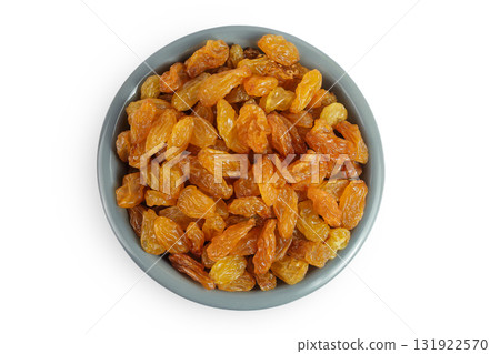 Yellow Raisins in ceramic bowl isolated on white background. Top view. Flat lay Yellow Raisins in ceramic bowl isolated on white background. Top view. Flat lay 131922570