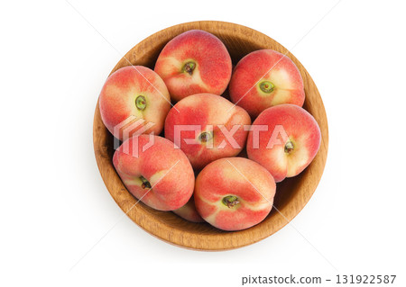 chinese flat donut peaches in wooden bowl isolated on white background. Top view. Flat lay chinese flat donut peaches in wooden bowl isolated on white background. Top view. Flat lay 131922587