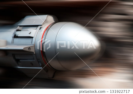 Close-up of metallic missile body in flight motion showcasing sleek design and dynamic energy 131922717