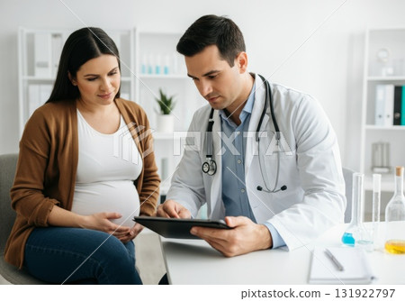 Pregnant woman consulting with obstetrician in modern clinic, discussing health and pregnancy 131922797