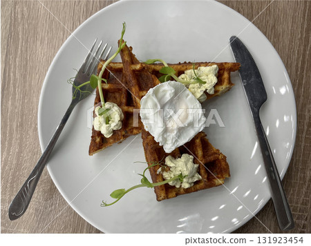 delicious and appetizing cheese waffles on a plate with auce delicious and appetizing cheese waffles on a plate with auce 131923454