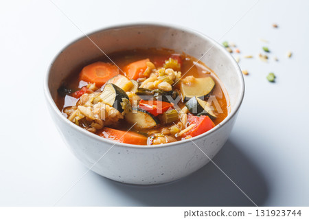 Vegetarian bean tomato soup with vegetables on white background. 131923744