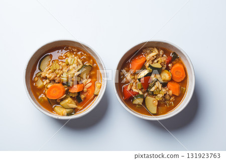 Vegetarian bean tomato soup with vegetables on white background. Vegetarian bean tomato soup with vegetables on white background. 131923763