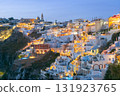 Evening lights of hillside buildings in Fira, Santorini, Greece 131923765