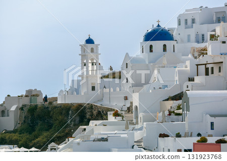 Church with blue dome at sunset in Fira, Santorini, Greece 131923768