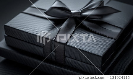 Luxurious black gift box with ribbon for elegant presentations Luxurious black gift box with ribbon for elegant presentations 131924115