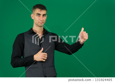 Set of videos with handsome European businessman in classic suit vest and black shirt showing different emotions gestures and confident poses on green chroma key background with copy space 131924405