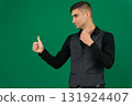 Set of videos with handsome European businessman in classic suit vest and black shirt showing different emotions gestures and confident poses on green chroma key background with copy space 131924407