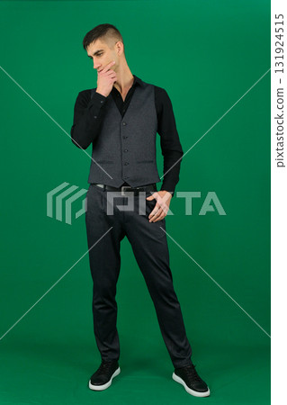 Set of videos with handsome European businessman in classic suit vest and black shirt showing different emotions gestures and confident poses on green chroma key background with copy space 131924515