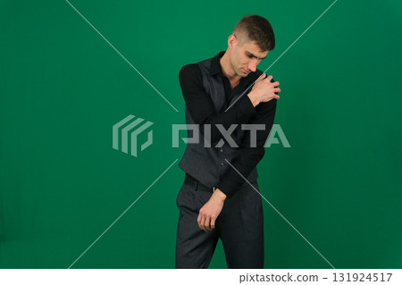 Set of videos with handsome European businessman in classic suit vest and black shirt showing different emotions gestures and confident poses on green chroma key background with copy space 131924517