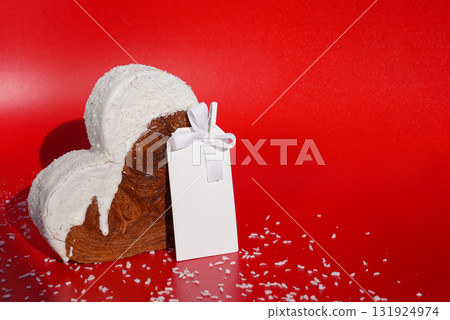 White paper note mockup template greeting holiday card Heart shaped coconut flavor croissant on red background with copy space. Puff pastry new trendy sweet dessert bakery. Creamy dough 131924974
