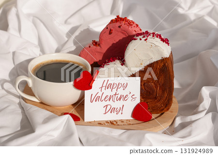 Happy Valentine's Day wishes saying caption on greeting card Coffee breakfast in rumpled bedding bed with heartshaped pastry croissant treat. Food experimentation viral dessert baking trend Happy Valentine's Day wishes saying caption on greeting card Coffee breakfast in rumpled bedding bed with heartshaped pastry croissant treat. Food experimentation viral dessert baking trend 131924989